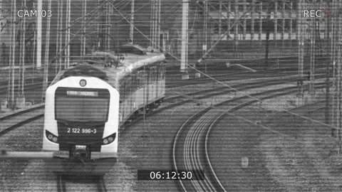 CCTV Security Camera view of Electric Passenger Train on Multiple Tracks Railway Stock Footage 151231975