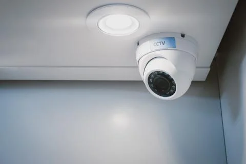 CCTV security camera on wall in the home office for surveillance monitoring home Stock Photos