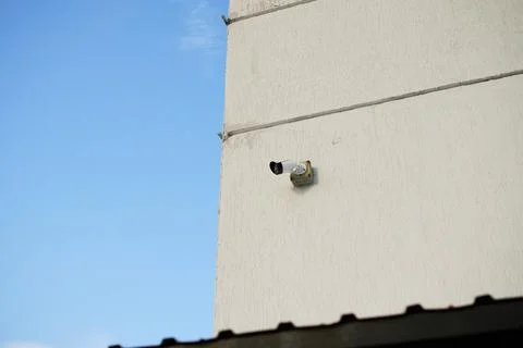 CCTV Surveillance Camera Installed on White Concrete Wall Stock Photos