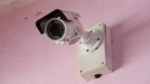 CCTV surveillance security camera mounted on the factory wall Stock Footage 236241476