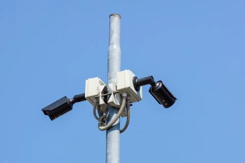 CCTV surveillance security camera vedio equipment in dark tone tower home and Stock Photos