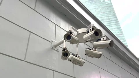 CCTV Video surveillance camera system scanning street in big city Video stock 332505524