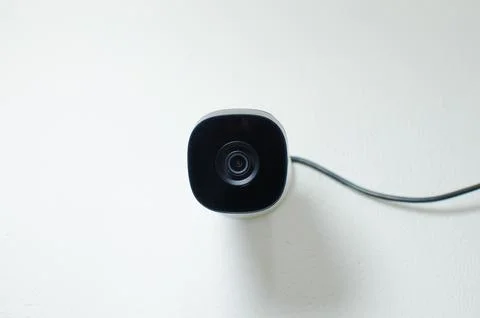 CCTV videocam, CFTV security camera, white camera with secure circuit, theft  库存照片