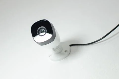 CCTV videocam, CFTV security camera, white camera with secure circuit, theft  库存照片
