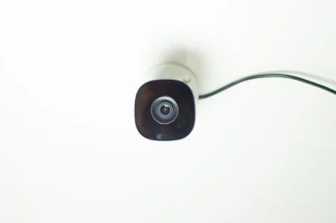 CCTV videocam, CFTV security camera, white camera with secure circuit, theft  库存照片