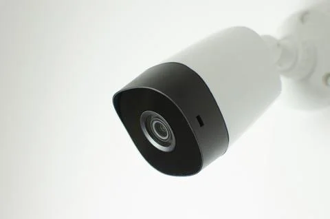CCTV videocam, CFTV security camera, white camera with secure circuit, theft  库存照片