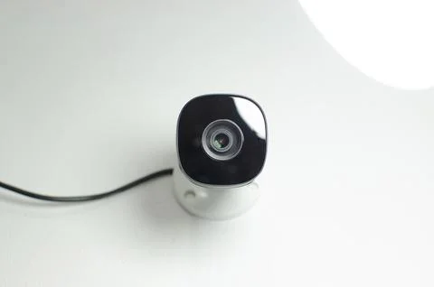 CCTV videocam, CFTV security camera, white camera with secure circuit, theft  库存照片