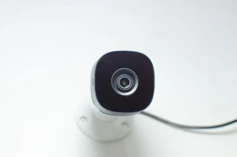 CCTV videocam, CFTV security camera, white camera with secure circuit, theft  库存照片