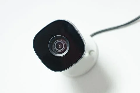 CCTV videocam, CFTV security camera, white camera with secure circuit, theft  库存照片