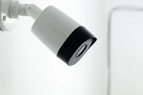 CCTV videocam, CFTV security camera, white camera with secure circuit, theft  库存照片