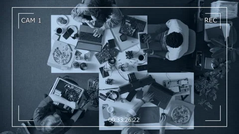 CCTV of Young Team of Web Engineers Working at Tables Filled with Devices Stock Footage 312451613