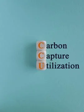 CCU (Carbon Capture and Utilization ) on wooden cubes on blue background. Stock Photos