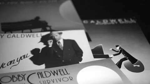 CD and artwork of CD and artwork of American singer-songwriter BOBBY CALDWELL Stock Footage 205415330