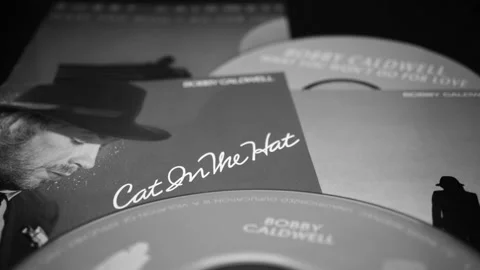CD and artwork of CD and artwork of American singer-songwriter BOBBY CALDWELL Stock Footage 205415422