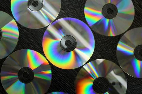 CD and DVD discs as a background image. Stock Photos