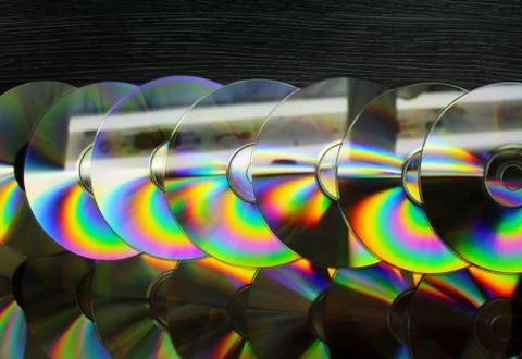 CD and DVD discs as a background image. Stock Photos