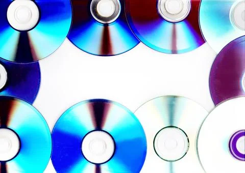 CD and DVD discs frame background with iridescent rainbow reflection light Фото