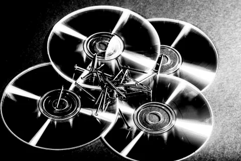 Cd and spikes Stock Photos