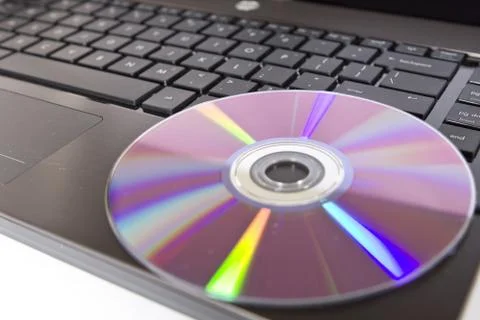 Cd on computer Stock Photos