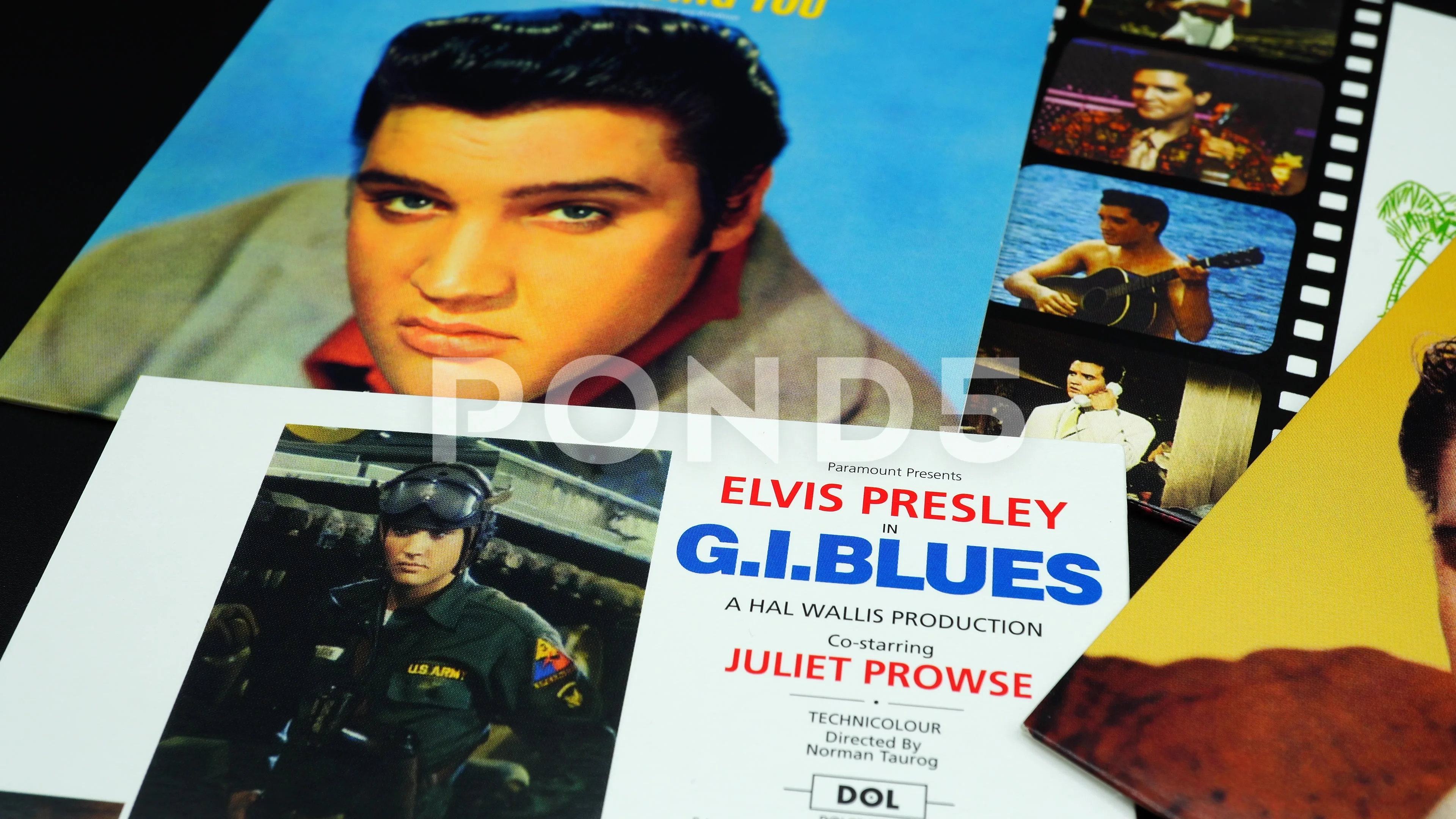 cd covers of Paramount films by Elvis Presley. Nicknamed The King of Rock  and