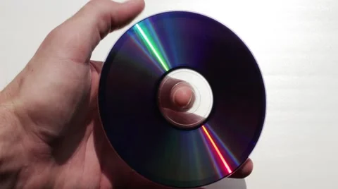 CD-disc reflected in man's hand 動画素材 66756672
