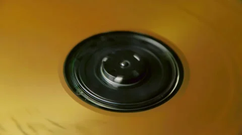CD with golden tones spinning  (Loop) Stock Footage