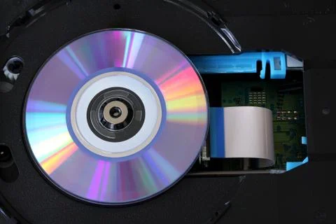 CD inside a DVD payer with  circuits, cables and boards - close up Stock Photos