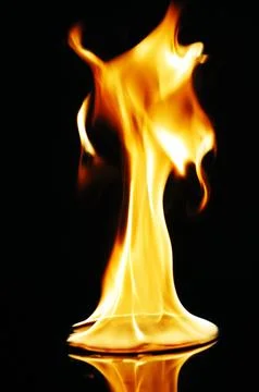 A CD or DVD disc burning in flames Stock Photos