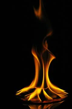 A CD or DVD disc burning in flames Stock Photos