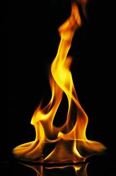 A CD or DVD disc burning in flames Stock Photos