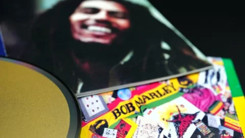 CD by reggae legend BOB MARLEY. He helped develop and spread reggae music aro Stock Footage 159247242