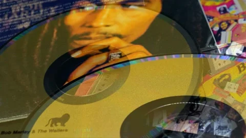CD by reggae legend BOB MARLEY. He helped develop and spread reggae music aro Stock Footage 159829530