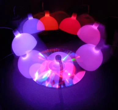 Cd rom storage disk reflections. Purple ambiance Stock Photos