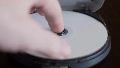 CD Spinning in Portable CD Player then being ejected. Stock Footage