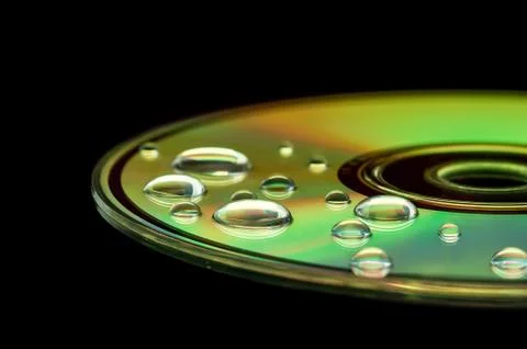 CD with water droplets Stock Photos