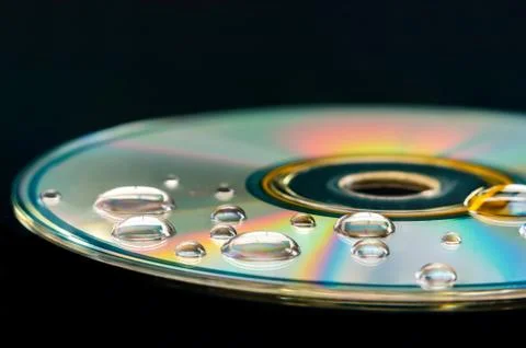 CD with water droplets Stock Photos