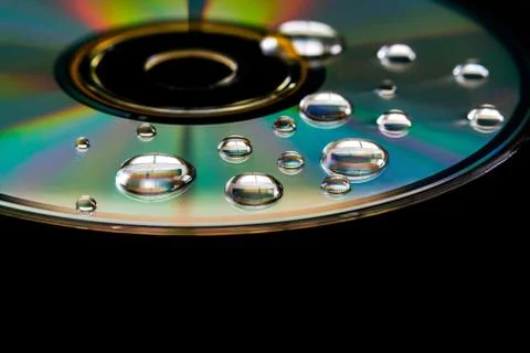 CD with water droplets Stock Photos