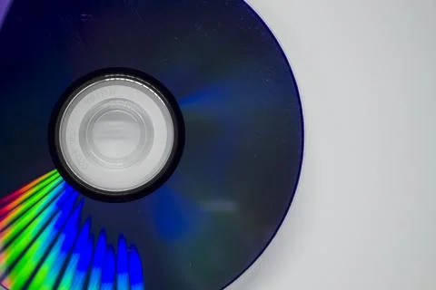 The CD is on a white background close-up. Stock Photos