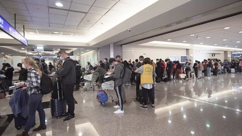 CDC worker in Airport Lines 스톡 동영상 129778415