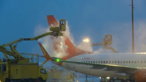 CDF 15 SunWing Boeing 737 at Dusk Deice Right Wing -Front view Stock Footage 76958041