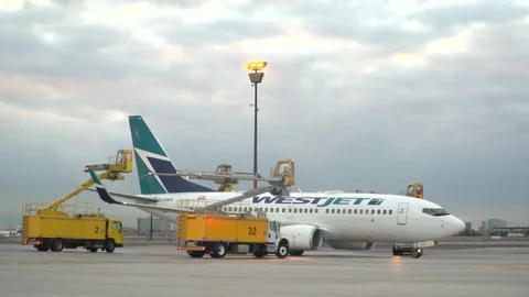 CDF 15 West Jet Boeing 737 Early Morning Type I Spray WS Stock Footage 76914896
