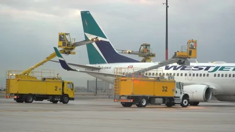 CDF 15 West Jet Boeing 737 - Early Morning Trucks Backing Up Stock Footage 76920659
