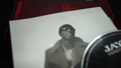 CDs and artwork of JAY-Z. rapper, entrepreneur, American record producer Video stock 116444184