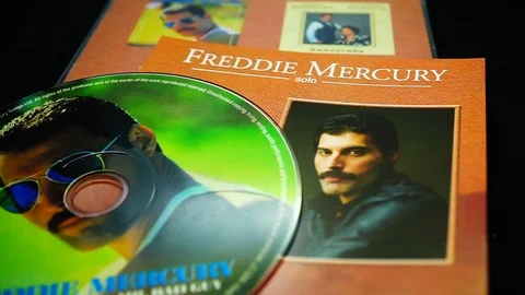 CDs and artwork of the special edition of two solo album by Freddy Mercury Stock Footage 105033515