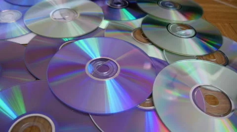CDs and DVDs On the Table Stock Footage 41498782