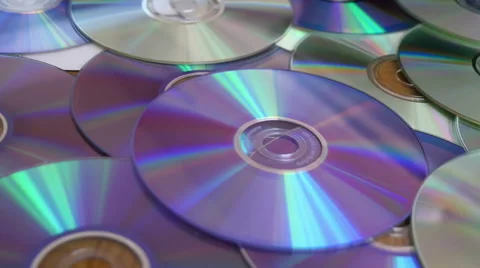 CDs and DVDs On the Table Stock Footage 41498833