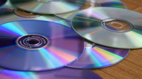 CDs and DVDs On the Table Stock Footage 41498894
