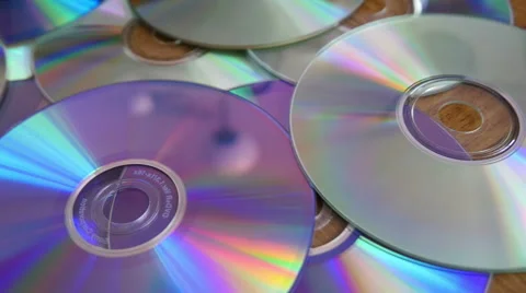 CDs and DVDs On the Table Stock Footage 41498961