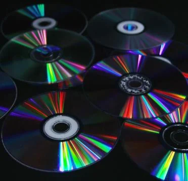 CDs DVD on a black background modern technologies the color spectrum Stock Photos