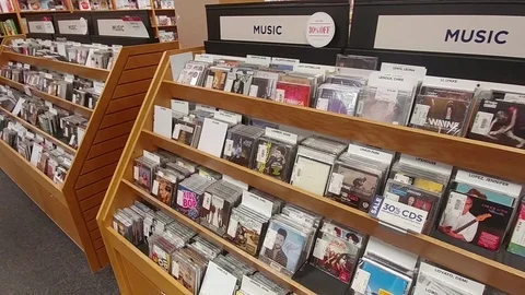 CDs in Store - Pan of racks of CDs Stock Footage 98118282